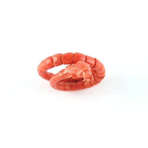 51 - A carved coral snake bracelet, approximately 37.8 grams.