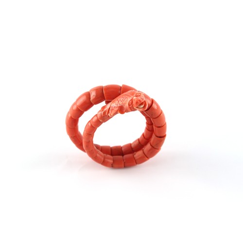 51 - A carved coral snake bracelet, approximately 37.8 grams.