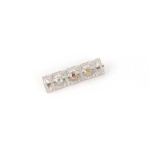 89 - An Art Deco fancy coloured diamond & white diamond rectangular panel brooch, set with a fancy pale p... 