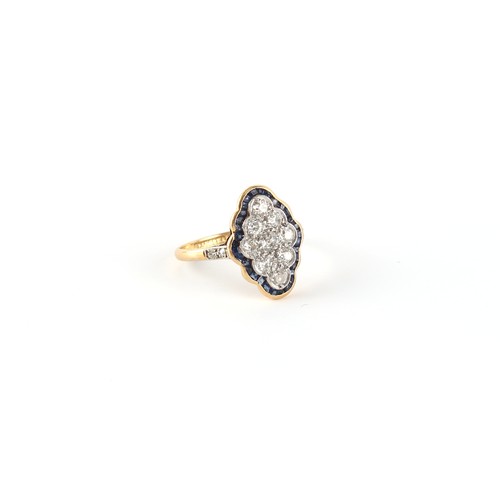 91 - An Art Deco 18ct yellow gold & platinum sapphire & diamond shaped oval panel ring, the centre diamon... 