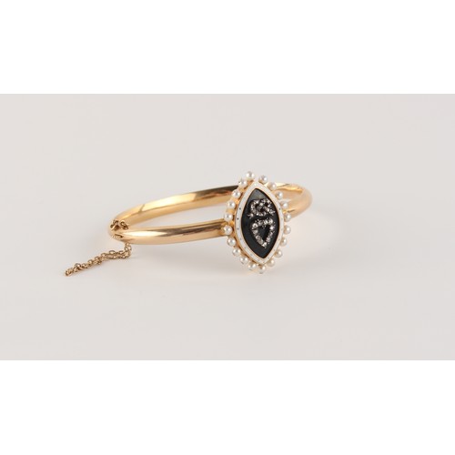 47 - An unmarked gold (tests 14/15ct) hinged bangle, the diamond pearl & enamel navette shaped mourning p... 