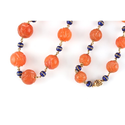 93 - An unmarked yellow gold (tests 18ct) carved carnelian agate bead necklace with blue enamel bead spac... 