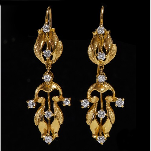 44 - A pair of unmarked 18ct yellow gold (tested) pendant earrings, each set with seven round brilliant c... 