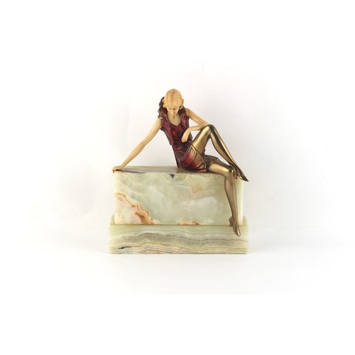 234 - Property of a gentleman - a reproduction Art Deco style figure of a lady on green onyx base, 8.8ins.... 