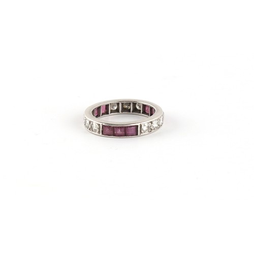 31A - Property of a lady - an unmarked platinum ruby & diamond eternity ring, approximately 4.5 grams, siz... 