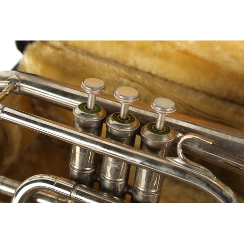 138 - Property of a deceased estate - a silver plated brass cornet, with mother-of-pearl buttons, stamped ... 