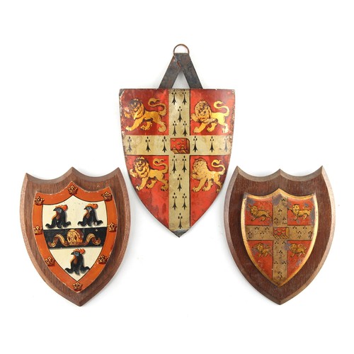 140 - Property of a gentleman - two tole peinte or toleware heraldic shields, probably 19th century, each ... 