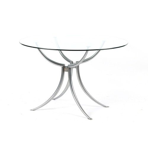 229 - Property of a deceased estate - a modern glass circular topped dining table, 45.25ins. (115cms.) dia... 