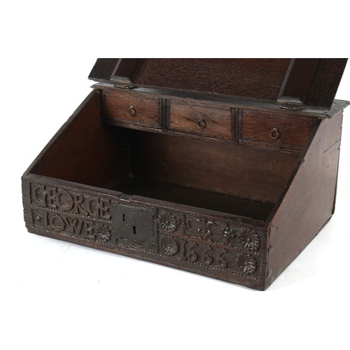 173 - Property of a gentleman - a 17th century carved oak Bible box, of good colour, the front carved with... 