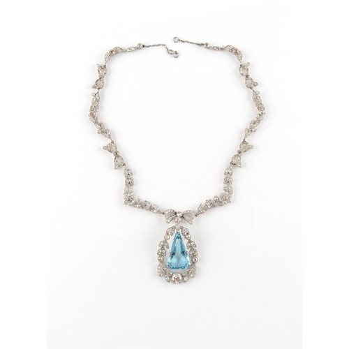 148 - A fine Belle Epoque aquamarine & diamond necklace, the angular drop shaped aquamarine of intense vib... 