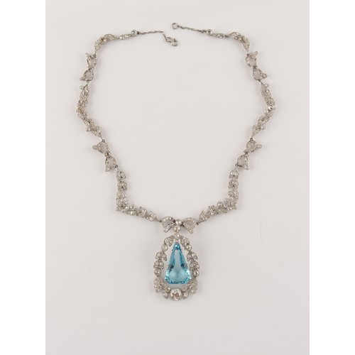 148 - A fine Belle Epoque aquamarine & diamond necklace, the angular drop shaped aquamarine of intense vib... 