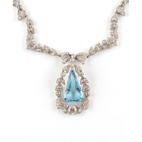 148 - A fine Belle Epoque aquamarine & diamond necklace, the angular drop shaped aquamarine of intense vib... 
