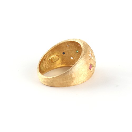 32 - A modern Italian 18ct gold multi gem set ring of textured form set with diamonds, rubies, emeralds &... 