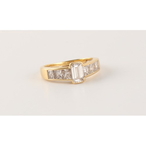 129 - Property of a deceased estate - an 18ct yellow gold diamond ring, the centre emerald cut diamond wei... 