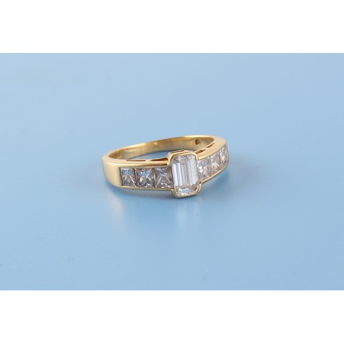 129 - Property of a deceased estate - an 18ct yellow gold diamond ring, the centre emerald cut diamond wei... 