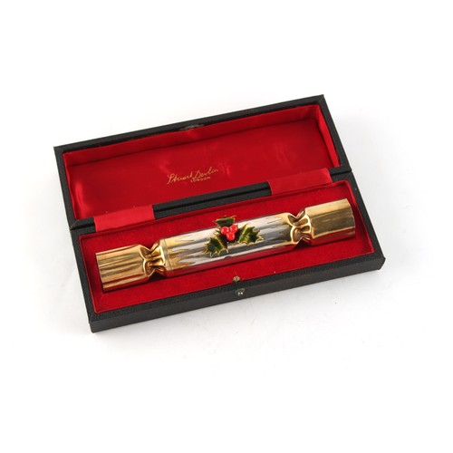 171 - Property of a lady - Stuart Devlin - a silver gilt & enamel novelty Christmas cracker, enclosing San... 