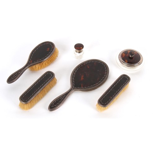 220 - Property of a deceased estate - an early 20th century silver & tortoiseshell four piece hand mirror ... 