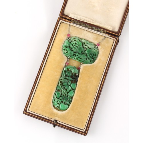 85 - A Chinese carved jadeite necklace composed of two jadeite panels carved with fruit & leaves, linked ... 