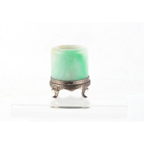 124 - Property of a gentleman - a Chinese jadeite archer's ring, 19th century, with apple green inclusions... 