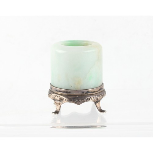 124 - Property of a gentleman - a Chinese jadeite archer's ring, 19th century, with apple green inclusions... 