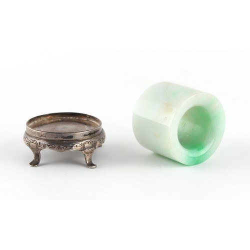 124 - Property of a gentleman - a Chinese jadeite archer's ring, 19th century, with apple green inclusions... 