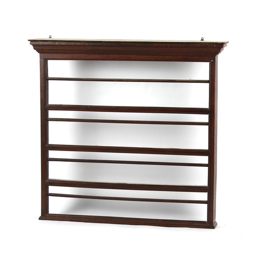 174 - Property of a lady - an 18th century oak plate rack or delft rack, 53.5ins. (136cms.) wide (overall)... 