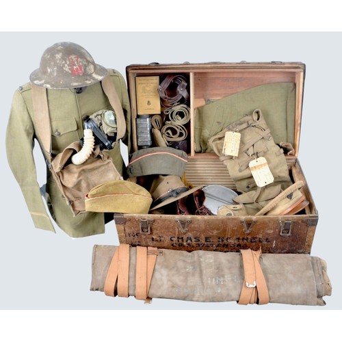 WW1 US Army Engineers Officers Uniform & Kit. From a First Lieutenant who served with the 37th Engineers in the Great War this unit were active in the Meuse -Argonne 1918. Trunk contains the following predominantly named items from 1st Lt Schnell..1.Mud covered US M17 helmet with red engineers insignia 2.Officer model Montana campaign hat with standard black & gold cords inc. spare cord 3.Garrison/Visor cap maker marked Lavenstein Bros Co ,Peterburg VA with minor moth around top comes with scarce rain cover dated 14 March 18 minor damage to leather.Two caps, Both piped with engineers scarlet & white . One cap is private purchase with rank bar & has some moth damage .Second cap is enlisted mans overseas cap 5.Sweater 6.Gas mask in excellent still supple undamaged condition with yellow filter , instruction card dated 6.8.18. 7.Ankle boots with toecaps. 8. Pair puttees. 9.Canteen M1910 with '18 drinking cup & cover marked US & 1917 dated. 10.Messtin set 11.Haversack M1910 with three labels of where posted one reads 'F.Co 37th Engrs 1st Lt CC Schnell Pack,Camp Sherman ,Ohio 12. Trousers & Tunic with original rank & engineers insig. & shoulder patch of Third Army . Right breast pocket contains telegram from 1st Lt Schnells wife arranging to meet him at the station with her train ticket dated 1919. Both jacket & trousers good match. 13  Trousers 14. Officers 'Sam Brown' Belt 15. Webbing belt with eagle buckle 16.Standard webbing pistol belt X 2 17.casual dress webbing belt 18.Compass in leather case 19.First Aid Pouch 1918 . 20.Condiments container 21.Engineers field manual 22.Book on military railways 23.Sleeping bag (Valise ).