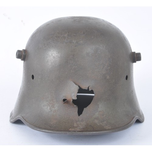 WW1 German Battle Damaged Helmet Shell. German helmet shell with bullet ...