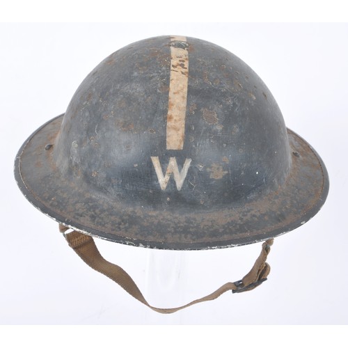 107 - WW2 British Wardens Helmet With White Stripe. This MkII helmet started life in a factory painted kha... 