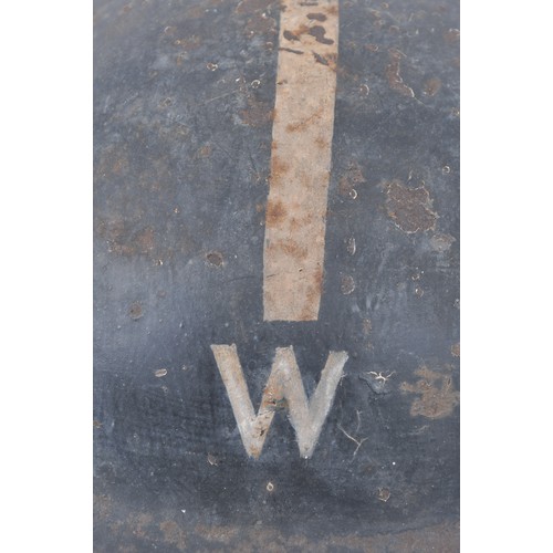 107 - WW2 British Wardens Helmet With White Stripe. This MkII helmet started life in a factory painted kha... 