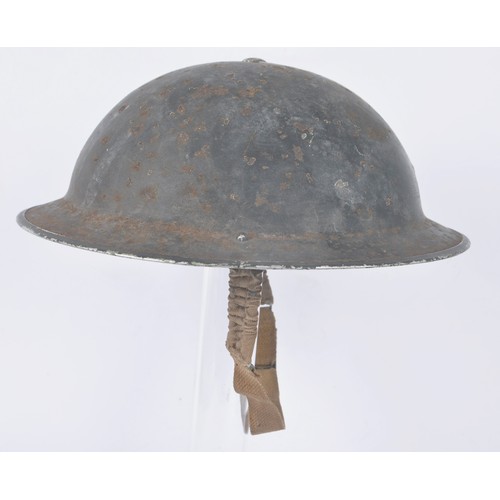 107 - WW2 British Wardens Helmet With White Stripe. This MkII helmet started life in a factory painted kha... 