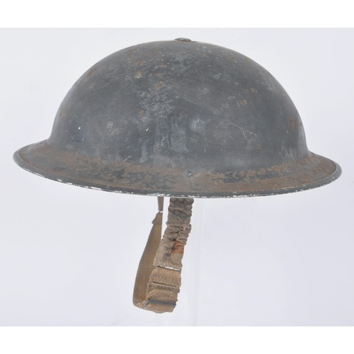 107 - WW2 British Wardens Helmet With White Stripe. This MkII helmet started life in a factory painted kha... 