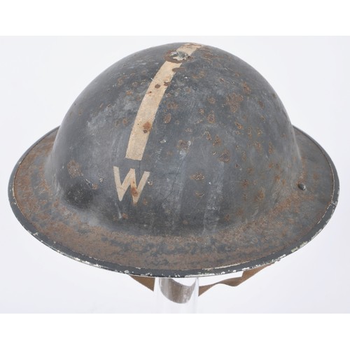 107 - WW2 British Wardens Helmet With White Stripe. This MkII helmet started life in a factory painted kha... 