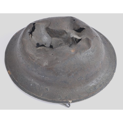 117 - Battle Damaged British MkII Helmet. Reputedly recovered in Holland , MkII combat shell with extensiv... 
