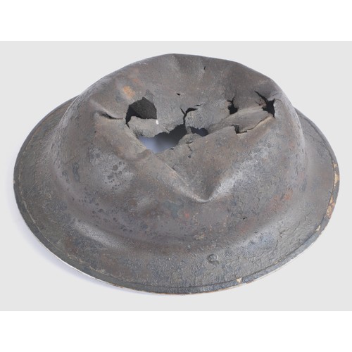 117 - Battle Damaged British MkII Helmet. Reputedly recovered in Holland , MkII combat shell with extensiv... 