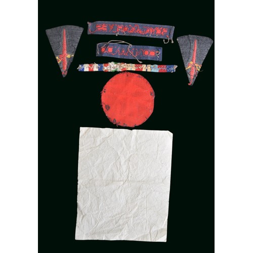134 - WW2 Royal Marines Battledress Insignia. A small insignia group which appears to have been removed fr... 