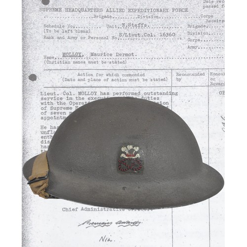 D-Day Operation Overlord Interest North Staffs Officer Helmet - Attached G-3 Division Supreme Headquarters (SHAEF) Involved In Operation Overlord Planning. A MkII steel helmet with decal of the North Staffordshire Regiment & name scratched into underside of rim 'MOLLOY' with service number.  . Maurice Dermot Molloy was a Lieutenant Colonel in the North Staffs regiment appointed to G-3 Division of Supreme Headquarters Allied Expeditionary Force ( SHAEF) who were the central operational hub for the invasion of Normandy , Operation Overlord & subsequent campaigns. The name of the officer is very faintly visible to the underside of the rim along with his service number. Helmet has Maker mark & date 'JSS 1940' ( Joseph Sankey ) .  1938 dated liner cradle with a thick textured khaki paint finish applied over its smooth factory finish. Minimal wear due to this officer being in a planning role albeit vital to the Invasion Of NW Europe. Included is the copy of a printed memo from the Public Record Office issued by Lieutenant-General HM Gale Chief Administrative officer at SHAEF headquarters in relation to S/Lieut Col 16360 MOLLOY, Maurice Dermot N.Staffs which reads ' Lieut.Col MOLLOY has performed outstanding service in the execution of his duties with the Operatiosn Section , G-s Division of Supreme Headquarters during the period of seven months in which he has held this appointment. He has distinguished himself by the unflagging energy , devotion to duty , great enthusiasm & efficiency which he has displayed during this arduous period. he has made a very positive contribution to the succesful execution of the Operations in North-West EUROPE.
