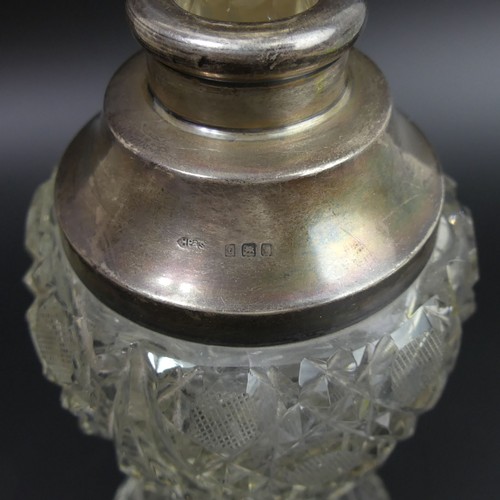 30 - George V cut glass silver mounted perfume bottle. London 1914. 25cm high.