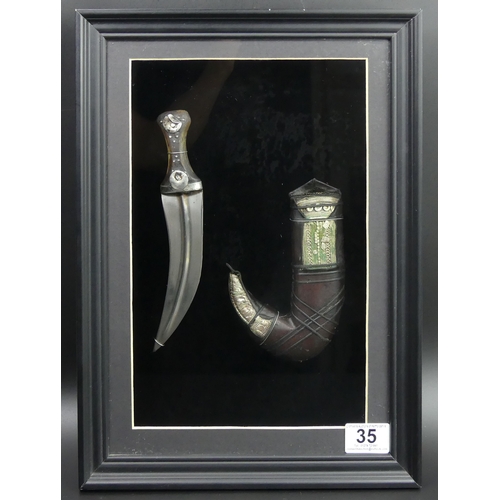 35 - 19th century Persian silver mounted dagger, framed and glazed. 40 x 29cm.