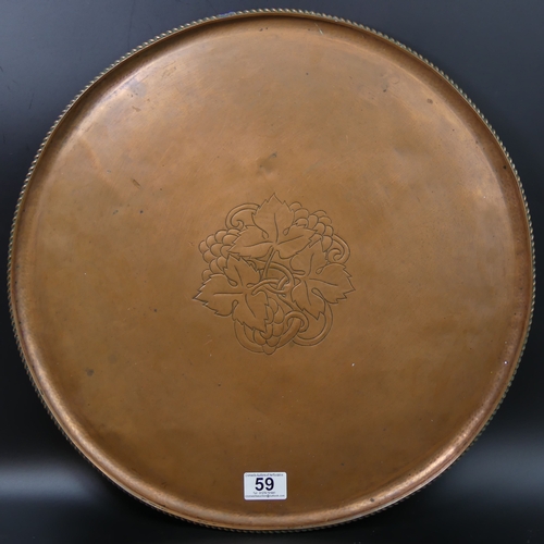 59 - Large Hugh Wallis arts and crafts copper tray. 46cm in diameter.