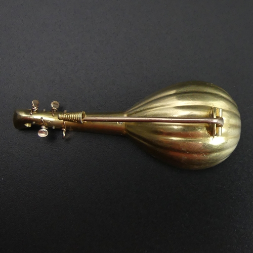 144 - Fine antique three colour yellow metal (un-tested) mandolin form brooch. 7.8 grams. 55mm long x 22mm... 