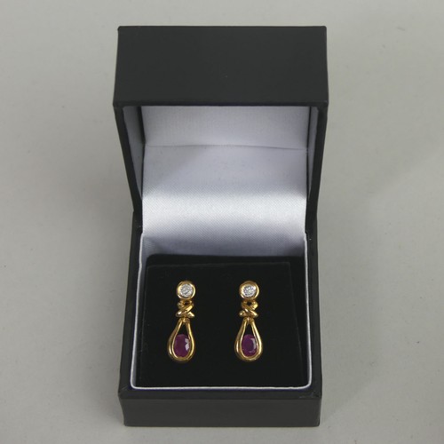 54 - A pair of 9 carat gold ruby and diamond earrings. 2.9 grams. 19mm long.
UK Postage £10.