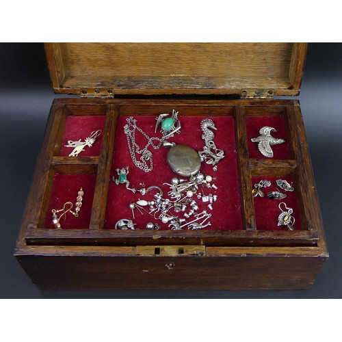 218 - An oak jewellery box and contents including silver and marcasite items.