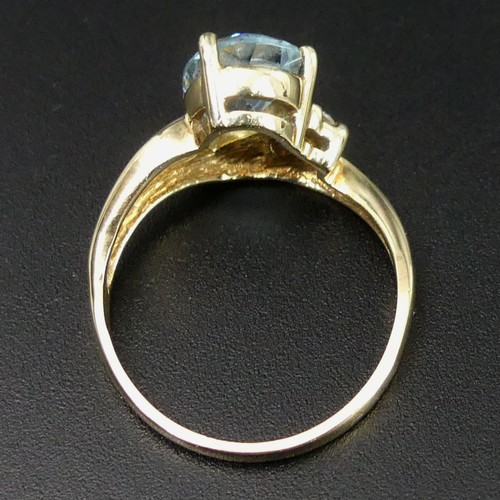 16 - 9 carat gold blue topaz and diamond ring, size N 1/2.
3.2 grams. Head 10.7mm band 1.8mm. UK Postage ... 