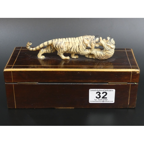 32 - Victorian rosewood, boxwood strung jewellery box, surmounted with a finely carved ivory tiger group.... 