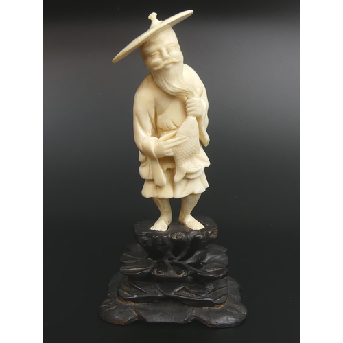 33 - Meiji period Japanese carved ivory Okimono of a fisherman. 13.5cm high.
UK Postage £15.