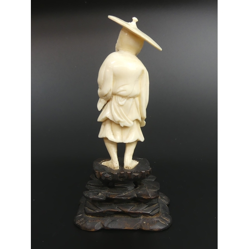 33 - Meiji period Japanese carved ivory Okimono of a fisherman. 13.5cm high.
UK Postage £15.