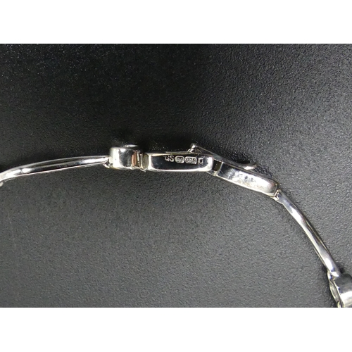 64 - 9ct white gold diamond set bracelet (.25ct). 3.8 grams. 17.5 cm long x 3.8 mm (widest).
UK Postage £... 