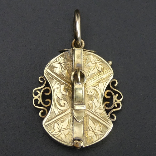 67 - Victorian yellow metal (un-tested) locket pendant of unusual design. 5.2 grams. 38 mm in length.
UK ... 