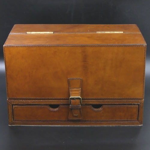 79 - A fine quality brown leather fitted stationary box with brass fittings.
24.5 cm high (closed) x 38 c... 